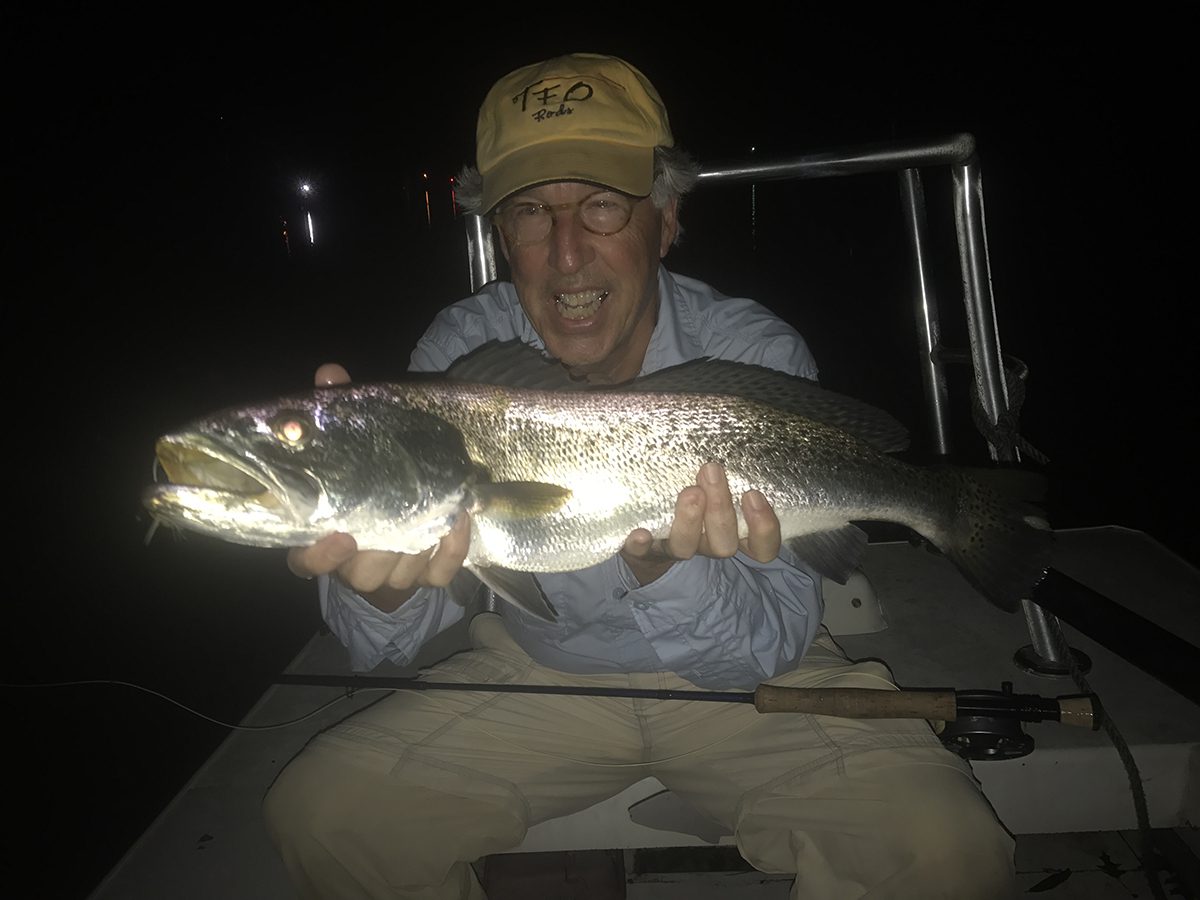 Rip Woodin of Rocky Mount shows off a big trout that came out at night. Photo: Gordon Churchill