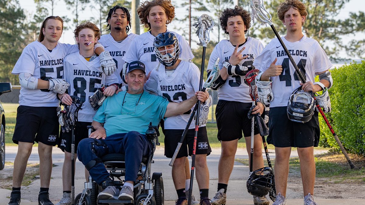 Capt. Gordon poses with members of the Havelock Rams boys lacrosse team, whom he coaches. Photo: Contributed