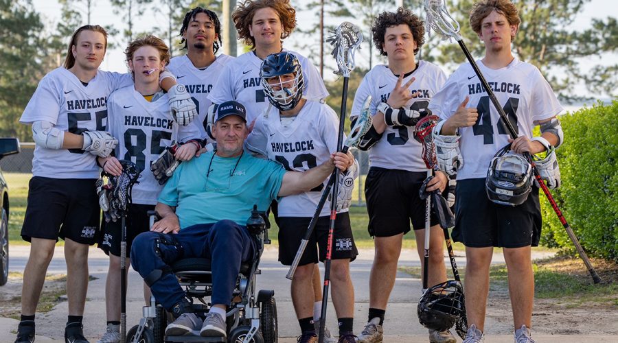 Capt. Gordon poses with members of the Havelock Rams boys lacrosse team, whom he coaches. Photo: Contributed