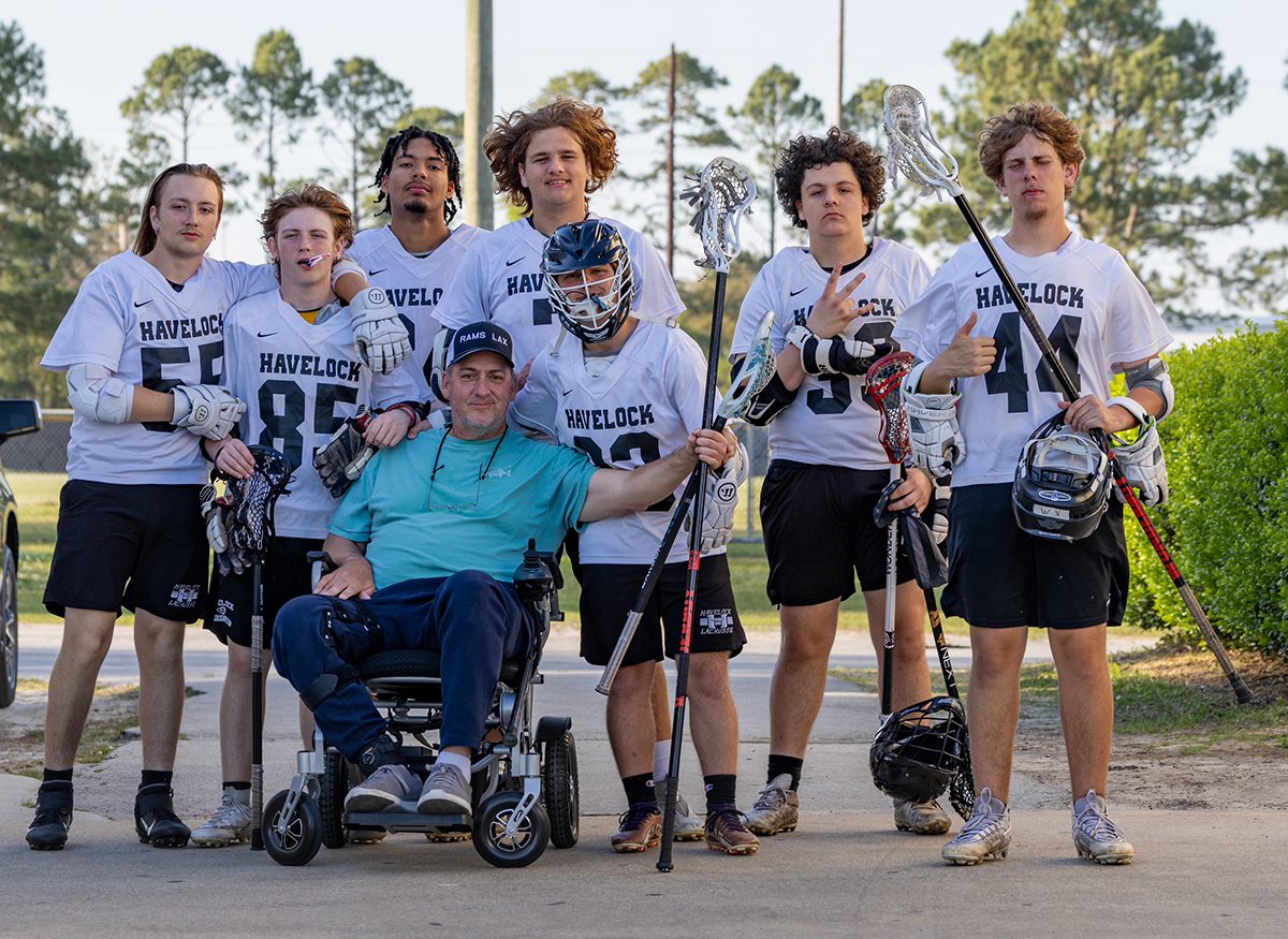 Capt. Gordon poses with members of the Havelock Rams boys lacrosse team, whom he coaches. Photo: Contributed