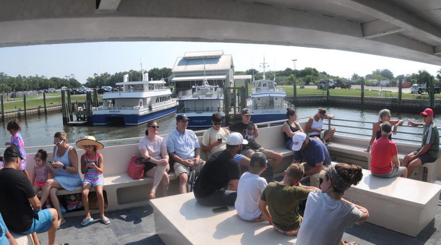 Passengers fill the rear deck of one of the Bald Head Island ferries as it leaves the Southport ferry terminal July 15. Photo: Mark Courtney