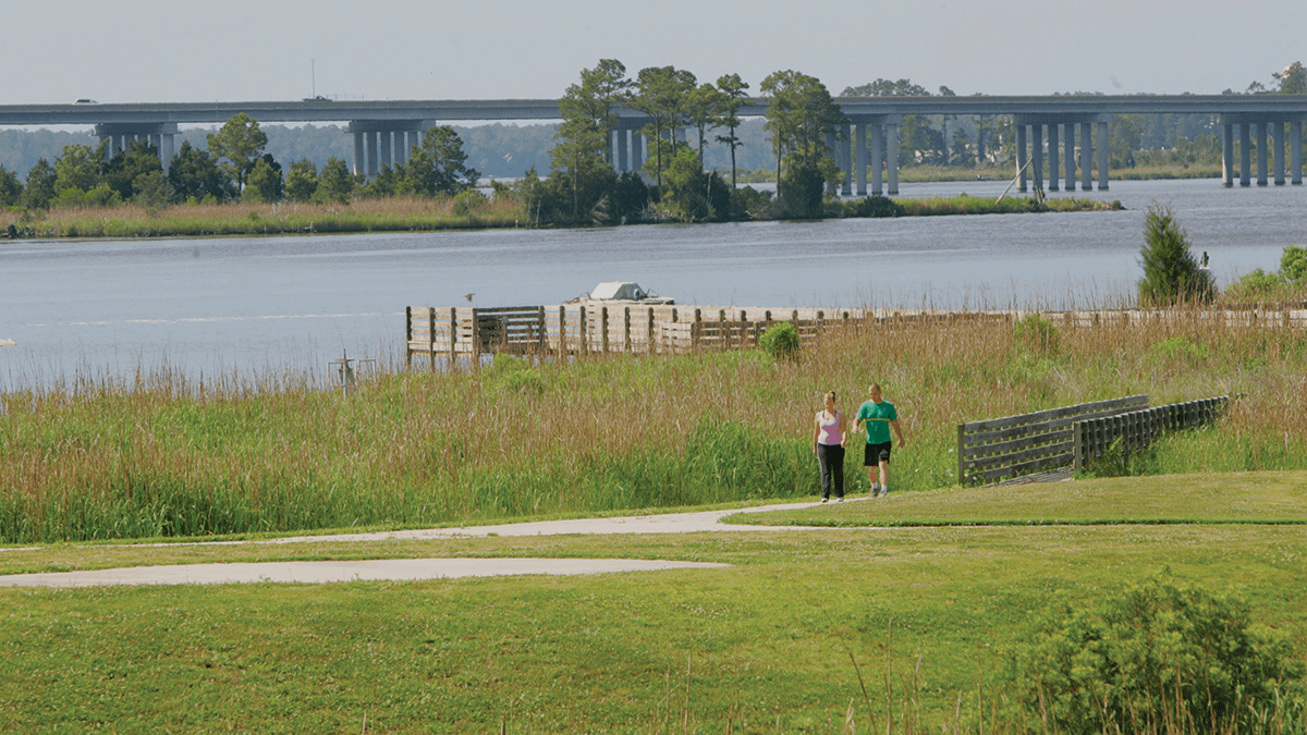 A couple walks along a trail at Sturgeon City Park overlooking Wilson Bay and the New River. Photo: City of Jacksonville