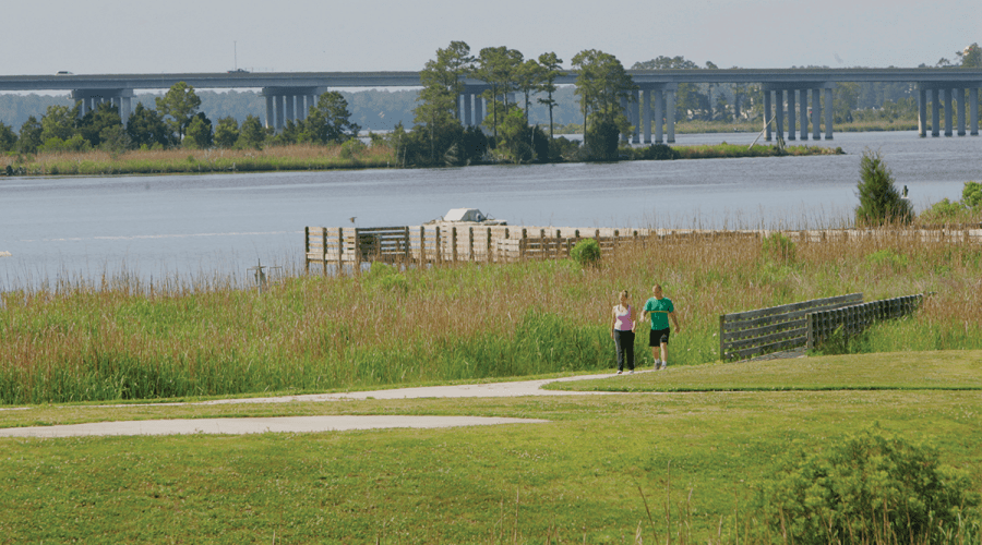 A couple walks along a trail at Sturgeon City Park overlooking Wilson Bay and the New River. Photo: City of Jacksonville