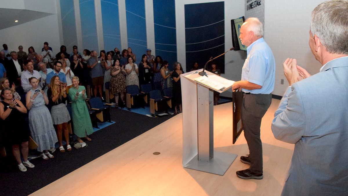 North Carolina Coastal Federation founder and former Executive Director Todd Miller is given a standing ovation during the Pelican Awards ceremony Saturday in Joslyn Hall on the Carteret Community College campus. Photo: Mark Hibbs