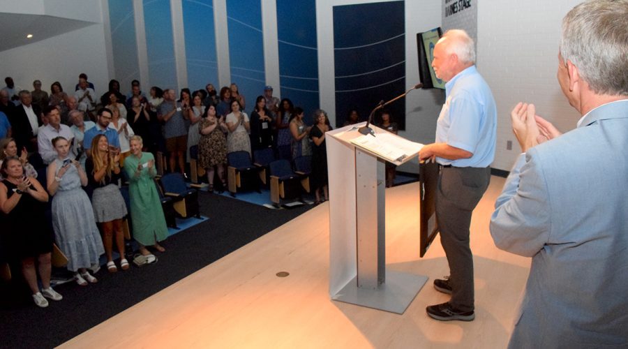 North Carolina Coastal Federation founder and former Executive Director Todd Miller is given a standing ovation during the Pelican Awards ceremony Saturday in Joslyn Hall on the Carteret Community College campus. Photo: Mark Hibbs