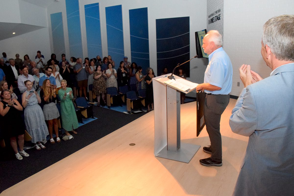 North Carolina Coastal Federation founder and former Executive Director Todd Miller is given a standing ovation during the Pelican Awards ceremony Saturday in Joslyn Hall on the Carteret Community College campus. Photo: Mark Hibbs