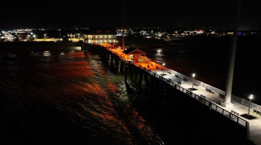 In this drone shot from above Jennette’s Pier, the stark difference between the old white lights and the new ones is evident. Photo: N.C. Aquarium at Pine Knoll Shores