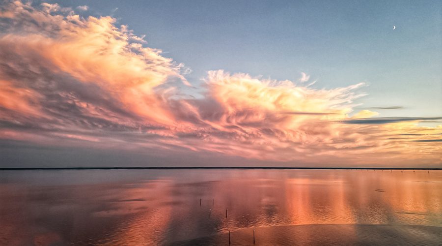 The sun sets over Albemarle Sound in Edenton near the N.C. Highway 32 bridge in this photo submitted by Tom Brennan of Edenton. "For the past couple of years I've been flying my drone over the Albemarle Sound capturing the dramatic cloud formations, sunsets and sunrises," Brennan told Coastal Review. "This time of year the sound becomes impossibly calm with remarkable sunsets."