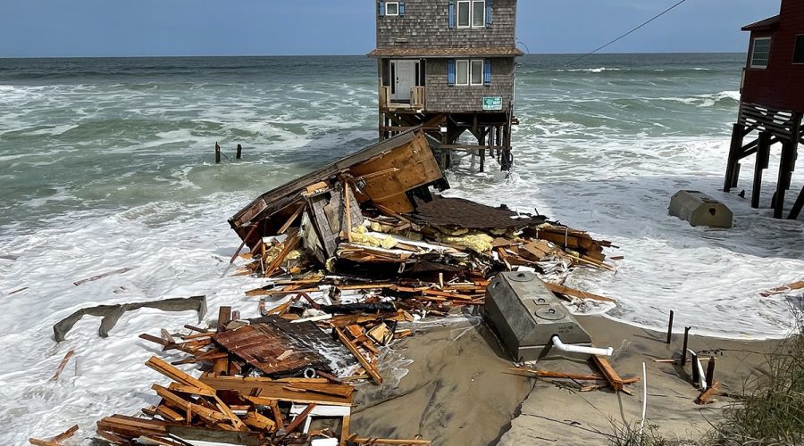 Debris associated with the collapsed house at 23039 G A Kohler Court is strewn along the beach Wednesday at Rodanthe. Photo: National Park Service