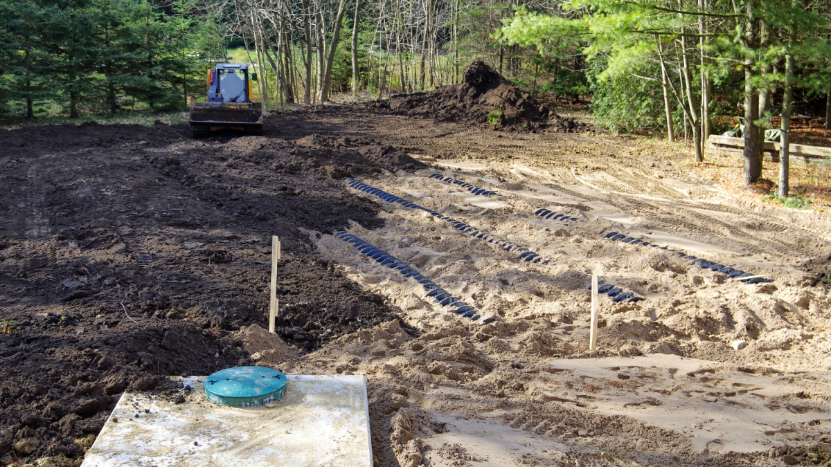 Above, a contractor is completing the installation of a septic system. Roughly half of North Carolina residential property owners rely on septic tanks as their wastewater management system. Photo: North Carolina State University Department of Crop and Soil Sciences