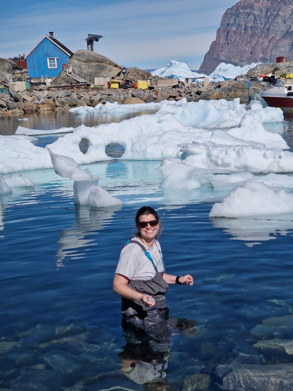 Samantha Farquhar stands in the waters of Greenland in 2023. Photo: Malin Stavridis