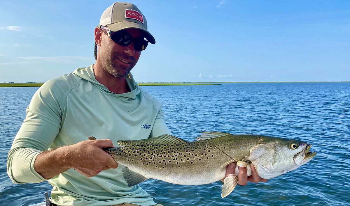 Neill Pollock shows off an 8-pound speckled trout caught on a topwater plug in one of Capt. Gordon’s hideaways. Photo: Gordon Churchill