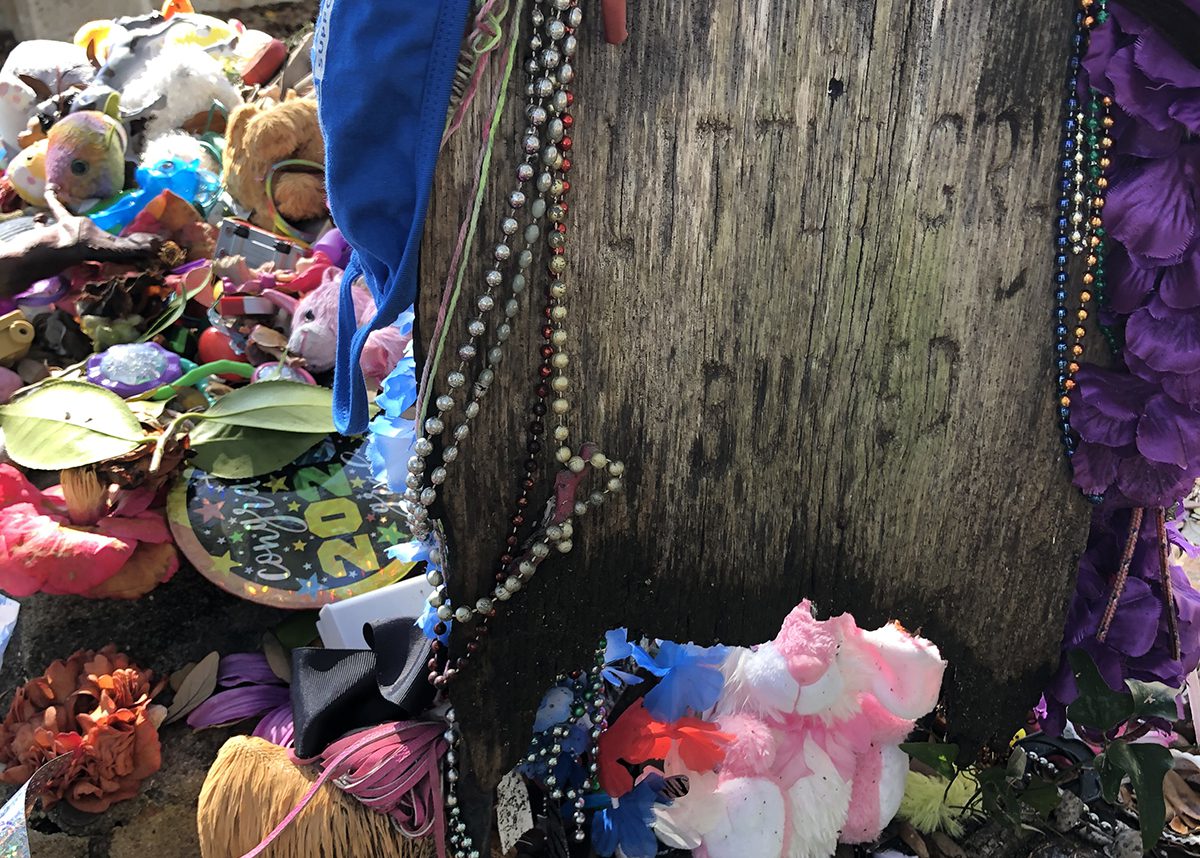 Adornments added by visitors to the girl's gravesite are a longstanding tradition at the Old Burying Ground. Photo: Bright Walker