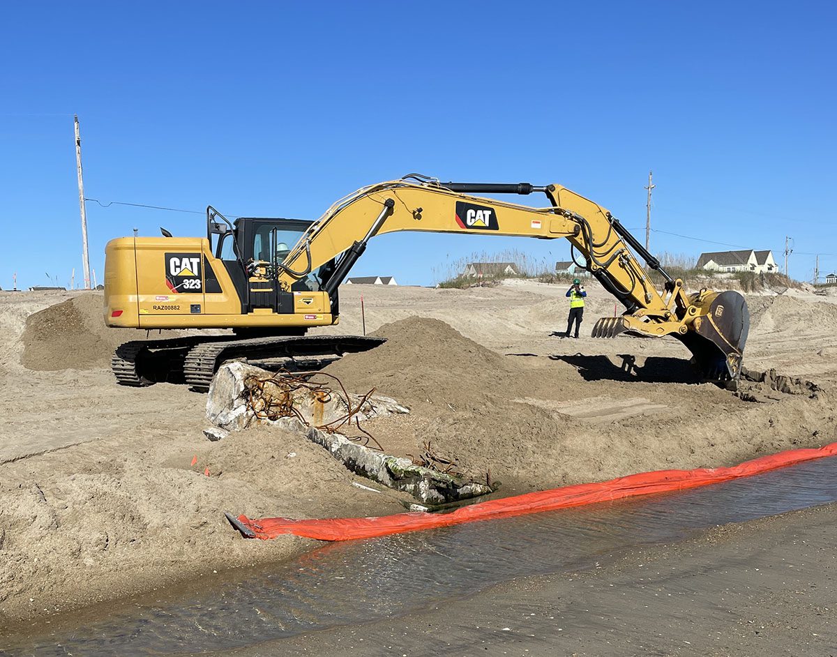 Contractors Bay West, LLC excavate the beach in search of petroleum-contaminated soil Oct. 15 at the Buxton Naval Facility, a Formerly Used Defense Sites property in the Cape Hatteras National Seashore. Photo: Terry Brooks/Corps