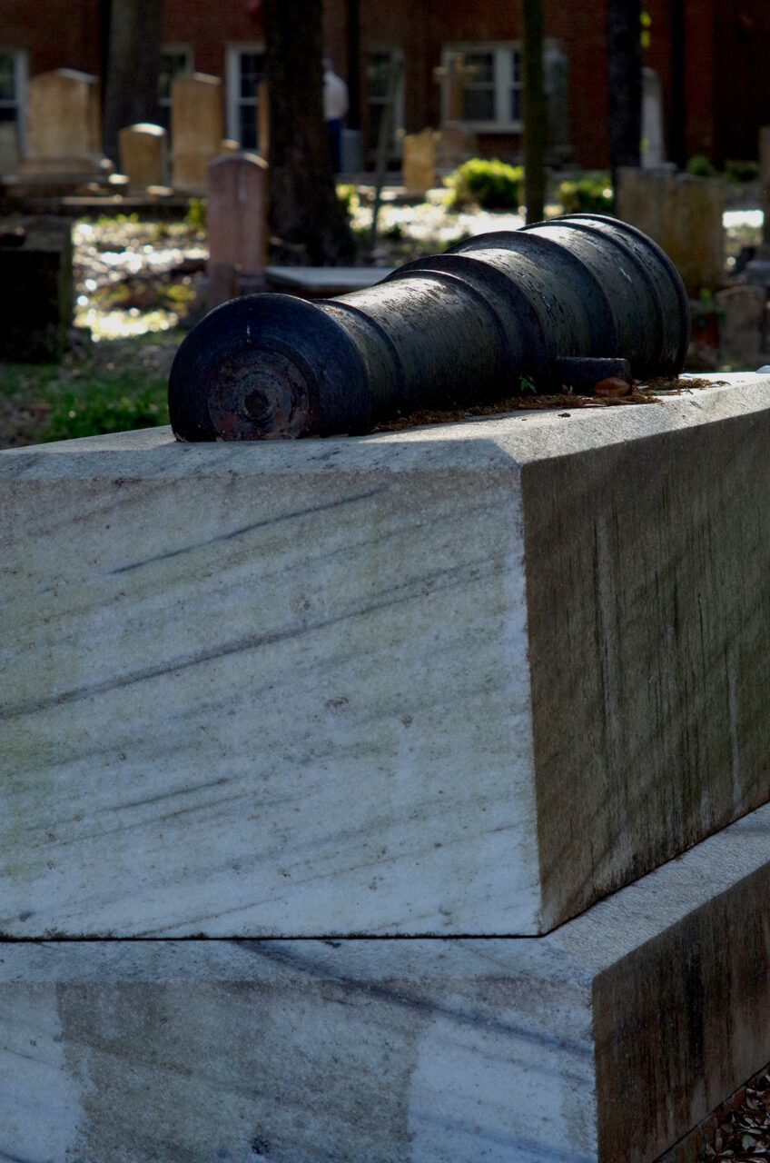 A cannon rests atop the tomb enclosing Capt. Otway Burns' remains in the Old Burying Ground in Beaufort. Photo: Mark Hibbs