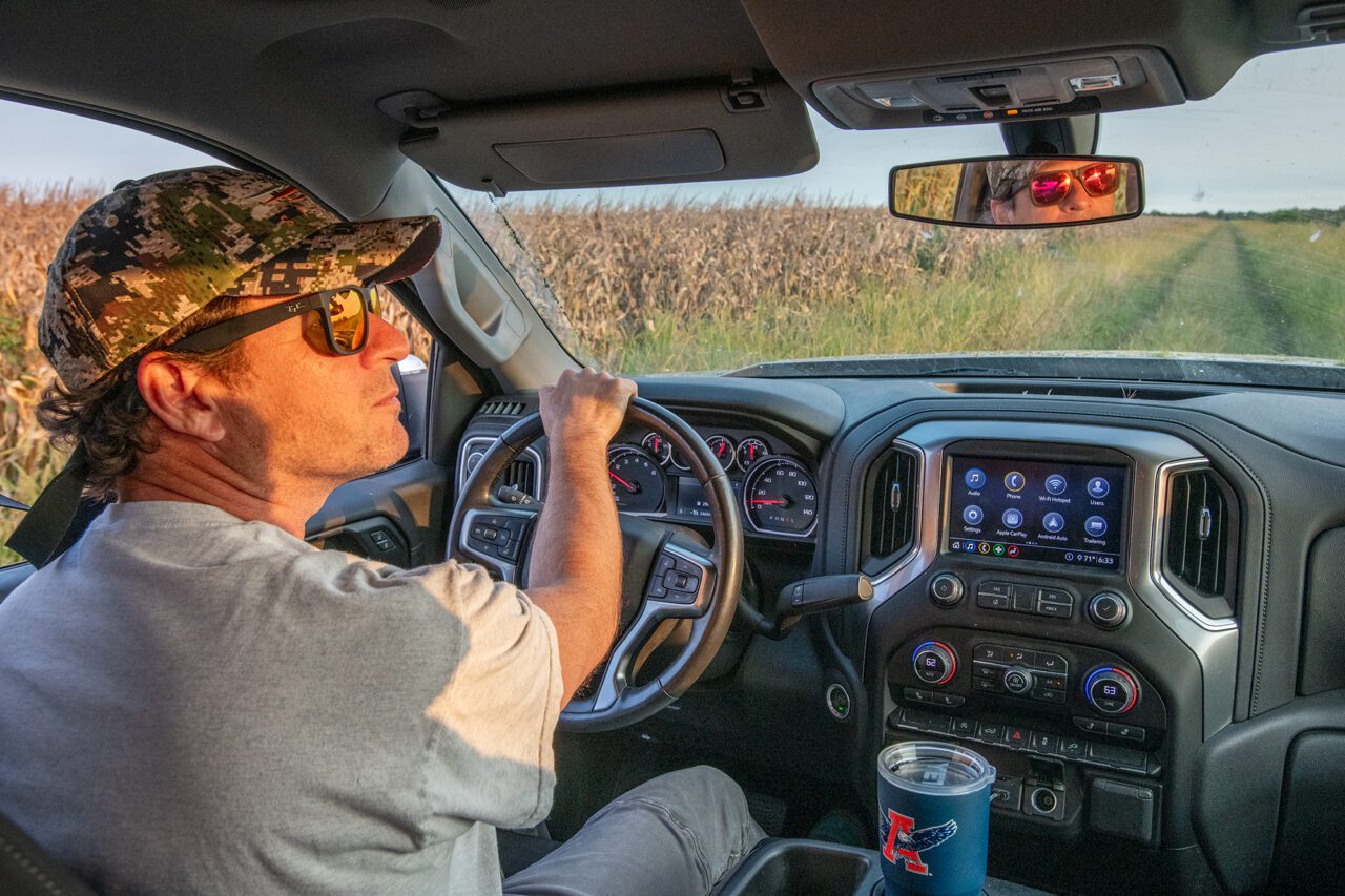 North Carolina Wildlife Resource Commission Hunter Education Instructor Chase Luker peers down the edge of a cornfield as he looks for black bear near the Pocosin Lakes Wildlife Refuge in Tyrrell County. Photo: Dylan Ray