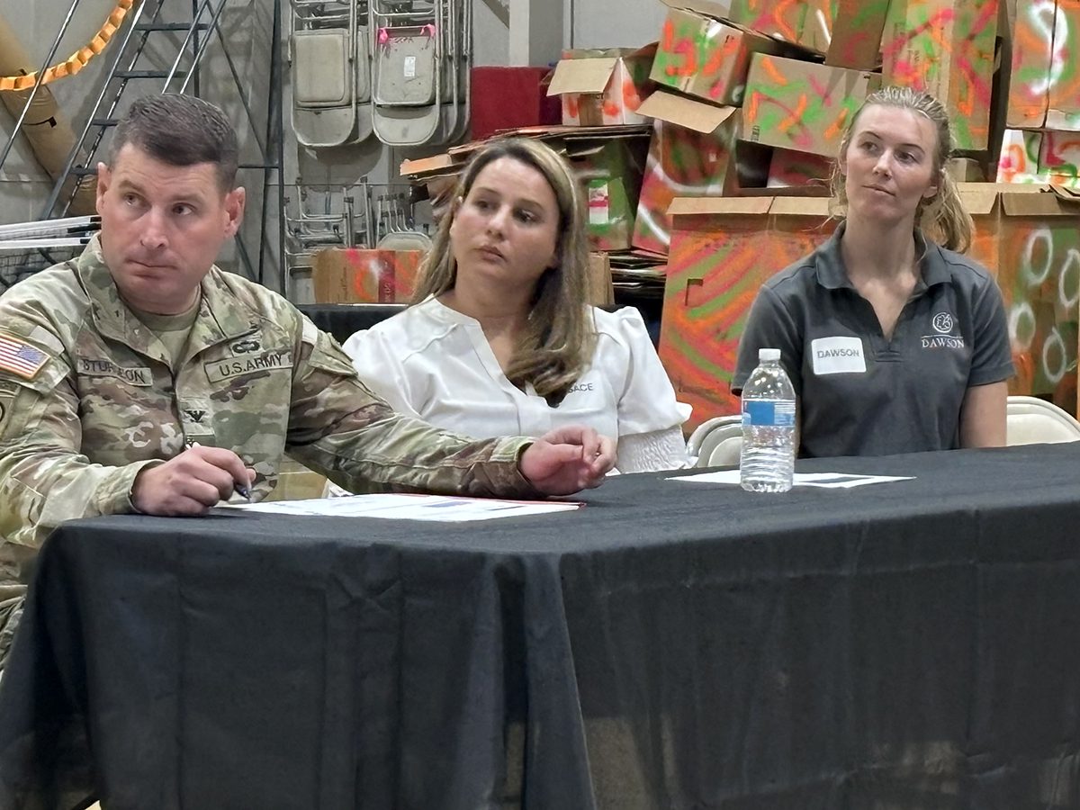 From left, U.S. Army Corps of Engineers Savannah District Commander, Col. Ron Sturgeon, Formerly Used Defense Sites Program Manager Sara Keisler, and Alexandra Jangrell-Tackett, program manager with Dawson, listen to residents Monday during a meeting the Corps hosted at the Fessenden Center in Buxton. Photo: Catherine Kozak