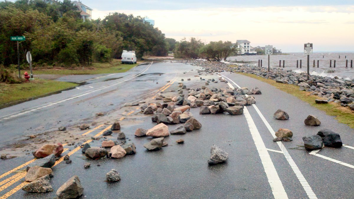 Wind and water associated with Hurricane Irene in 2011 lifted riprap put in place to stabilize N.C. Highway 12 and deposited it on the road. Photo: Town of Duck