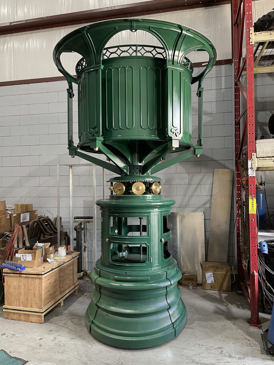 The completed pedestal cabinet, below with windows, will house the clockwork, and the rotating mechanism sits atop the small "chariot wheels." Photo: Dan Spinella