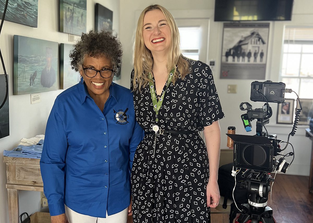 Pea Island Preservation Society Director of Outreach and Education Joan Collins poses with PBS director and producer Rebecca Ward at the Cookhouse Museum. Photo: Pea Island Preservation Society