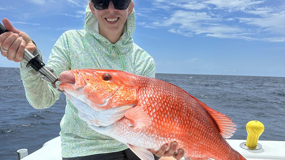 Katie Roller shows off a red snapper. Photo: Gordon Churchill