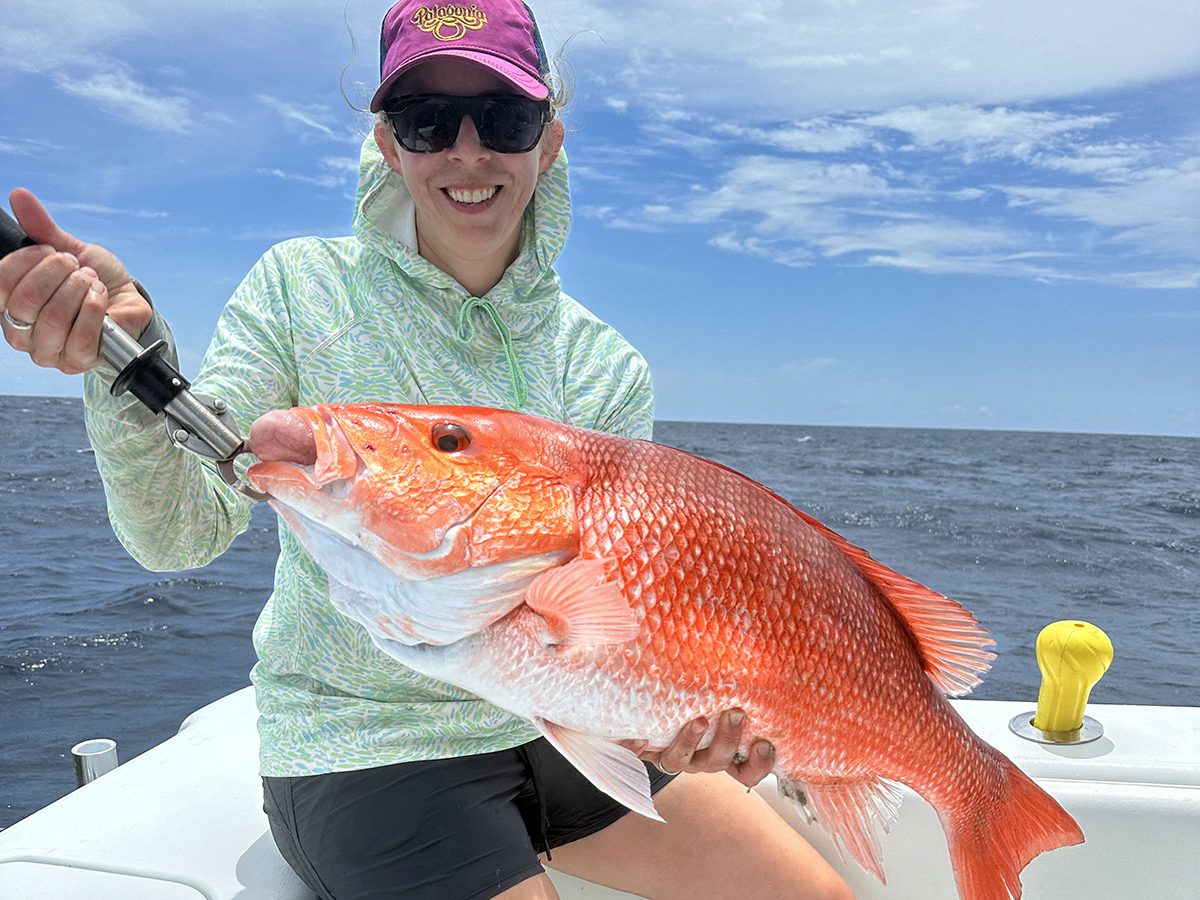 Katie Roller shows off a red snapper. Photo: Gordon Churchill