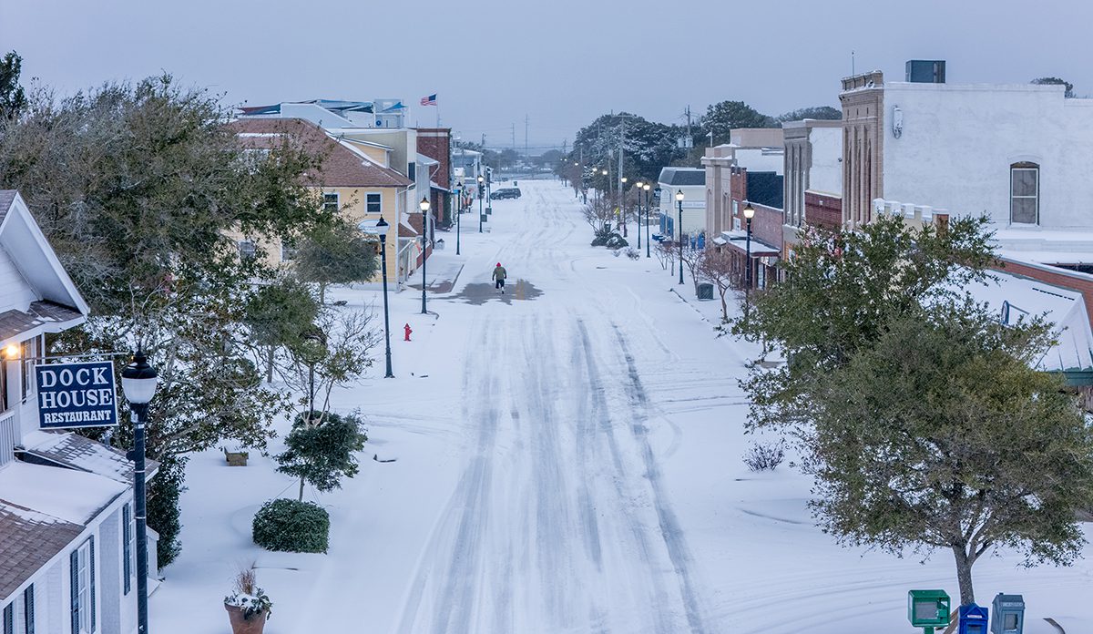 Snow covers Front Street in Beaufort Wednesday morning as the winter storm continues to blanket Carteret County and much of coastal North Carolina. Photo: Dylan Ray