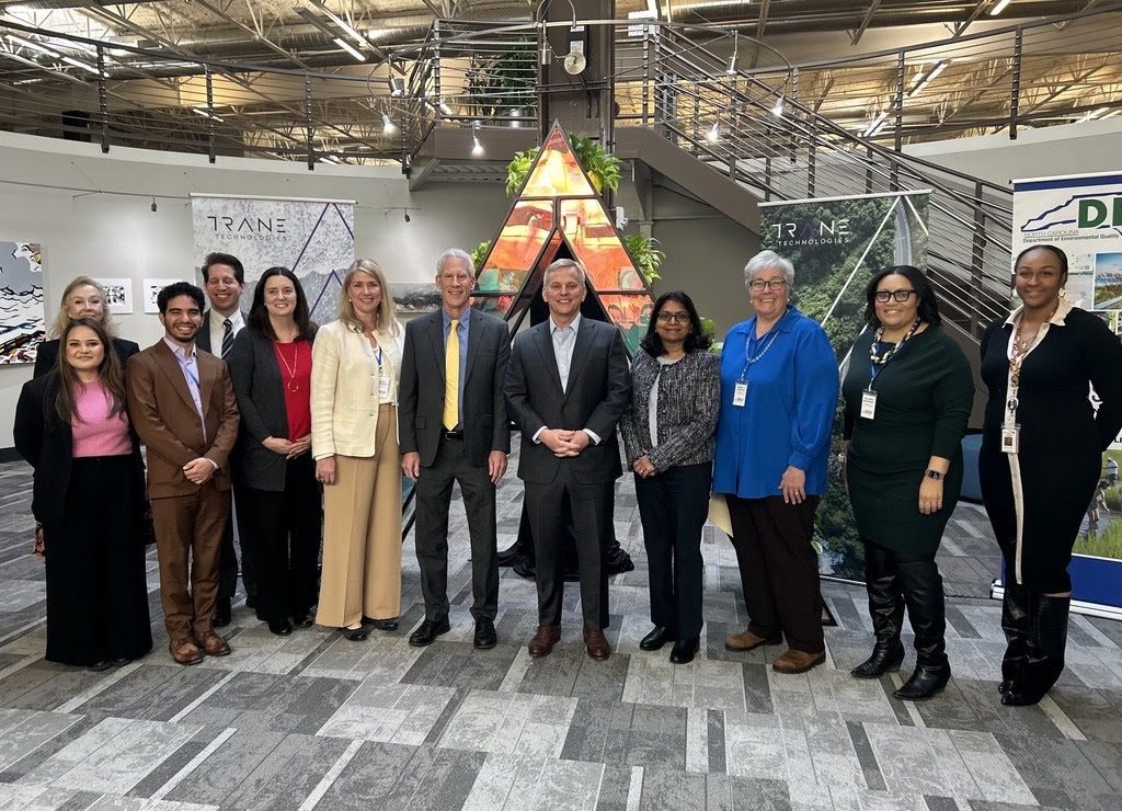 Gov. Josh Stein, center, is flanked by state environmental and U.S. Department of Energy officials and officials at Trane Technologies in Davidson announcing the Energy Saver rebate program earlier this week. Photo: NCDEQ