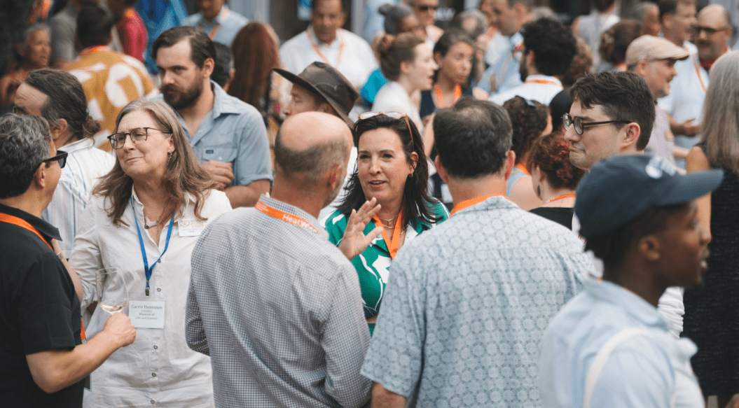 Ashley Ward (center), director of the Duke University Heat Policy Innovation Hub, greets participants at the HeatWise Policy Partnership Summit organized by Duke University in June 2024. Photo: Ashley Stephenson

