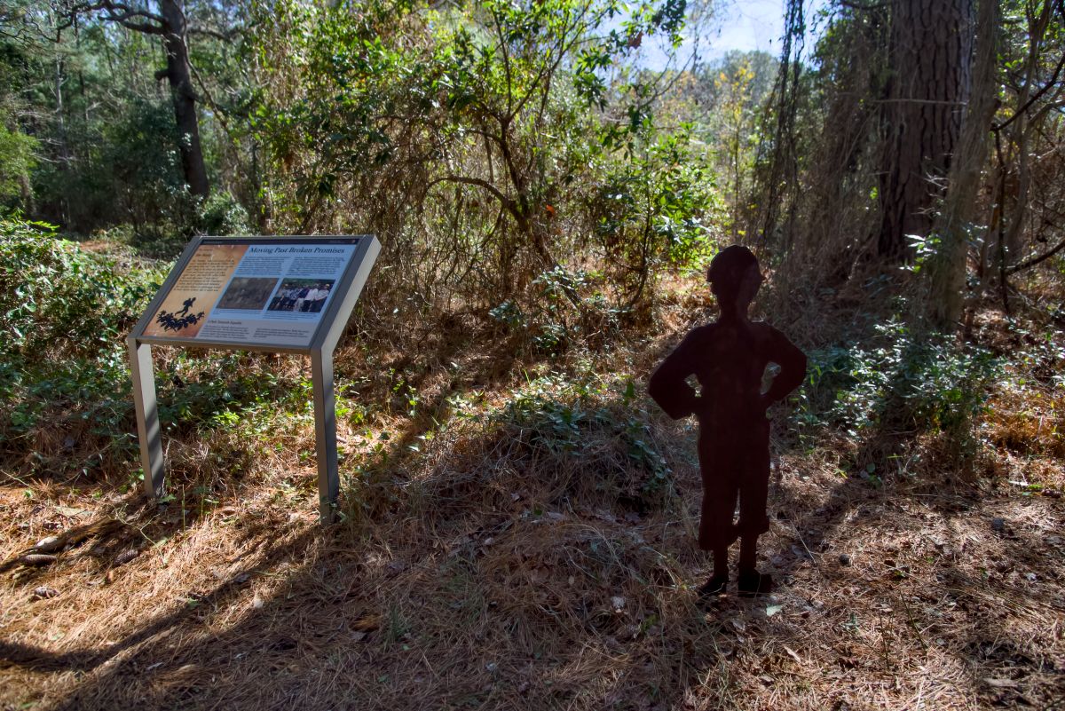 "Moving Past Broken Promises" interpretive sign with silhouette representing Jimmy Banks, a young boy whose parents were missing. He was cared for by Sarah Freeman.  Photo: Kip Tabb