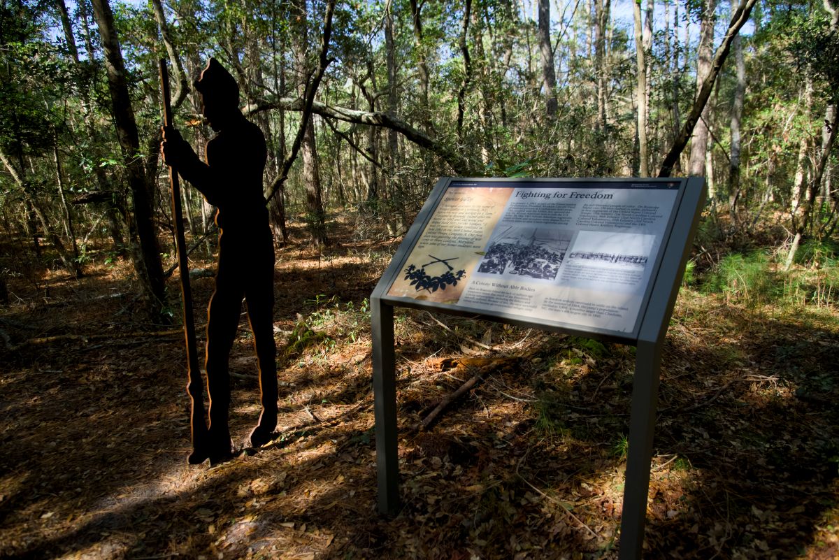 'Fighting for Freedom" interpretive sign with silhouette of Spencer Gallop, who became one of the first official Black soldiers in the U.S. Army.  Photo: Kip Tabb