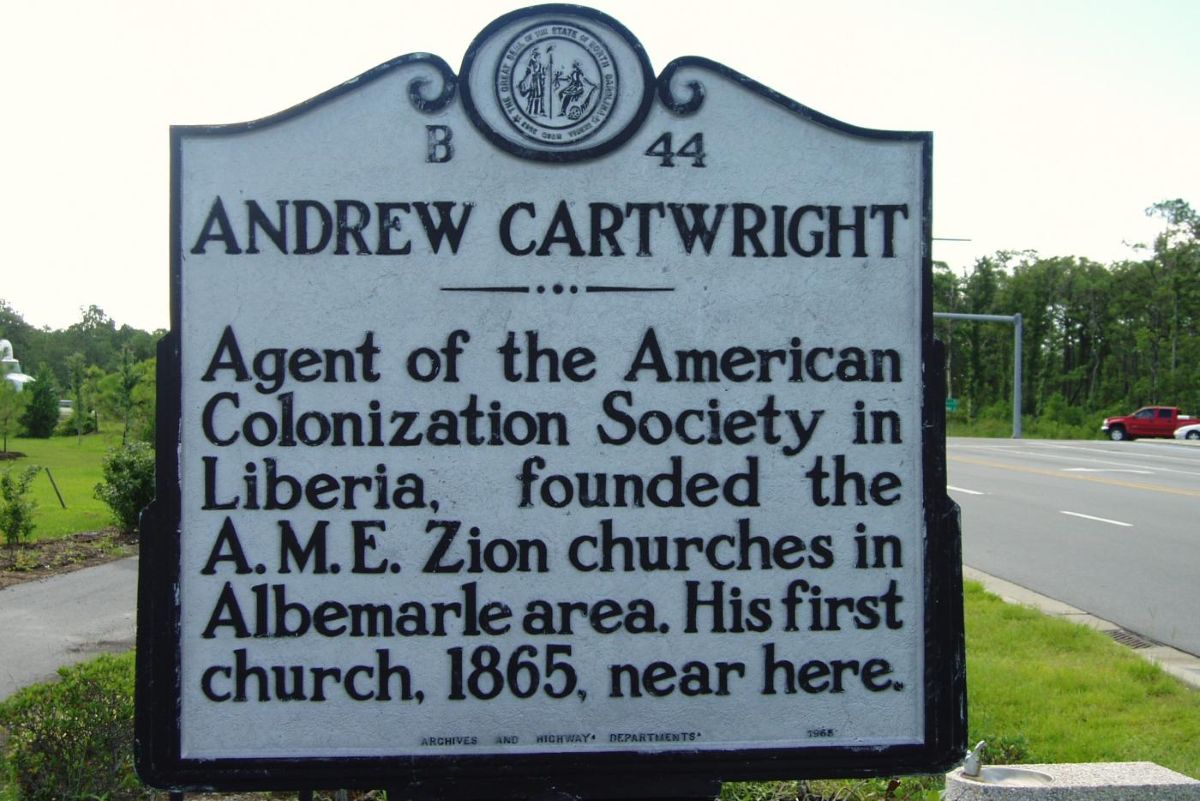 The N.C. Highway Marker posted on U.S. 64 southeast of Manteo reads, "Andrew Cartwright --Agent of the American Colonization Society in Liberia, founded the A.M.E. Zion churches in Albemarle area. His first church, 1865, near here." Photo: N.C. Department of Natural and Cultural Resources