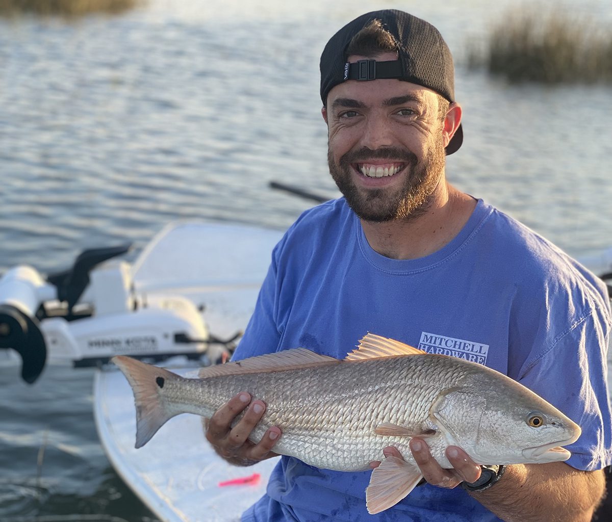 Ever with a super shallow draft skiff, Coach Josh Helms still had to get out to catch this beautiful redfish. Photo: Gordon Churchill