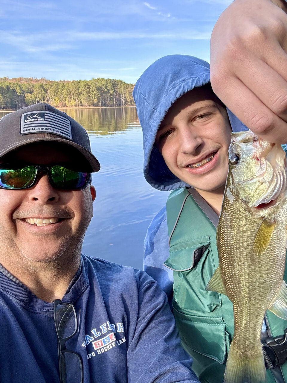 Mike and Jonny Curatolo show off their catch just before snacking on some Swedish fish. Photo: Gordon Churchill