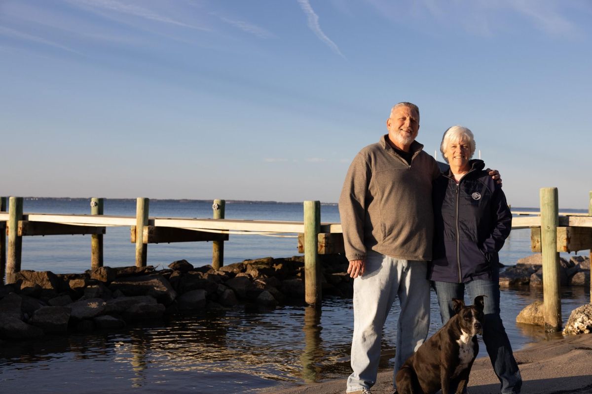 Vernon Kelly and Michele Kelly stand with their dog in front of their new sill. Photo: Ava Kocher