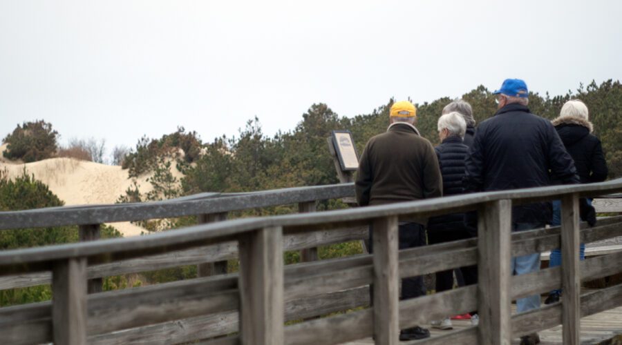 Visitors view the massive dune at Jockeys Ridge State Park from the boardwalk platform in March. Photo: Mark Hibbs