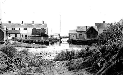 View of Pudding Dock, ca. 1895. From James L. Garvin & Susan Grigg, Historic Portsmouth: Early Photographs from the Collections of Strawbery Banke (Revised edition, Strawbery Banke Museum, 1995)