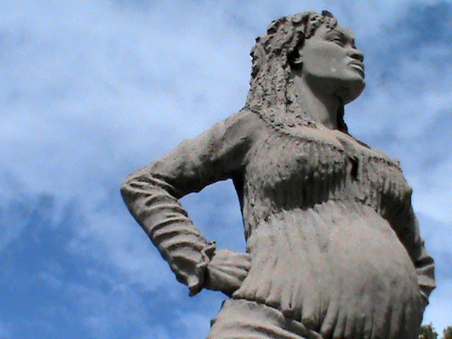 Statue erected in honor of the freedom fighter Solitude, Point-à-Pitre, Guadeloupe. In the 1790s, Solitude escaped from slavery and joined a maroon settlement called La Goyave in the hills of Guadeloupe. Though pregnant, she was later active in the armed resistance against Napoleon’s forces when they attempted to re-enslave the island’s population in 1802. Eventually captured, she was given a death sentence. Her execution was stayed but only until the day after the birth of her child. Today she is widely celebrated throughout the French West Indies.