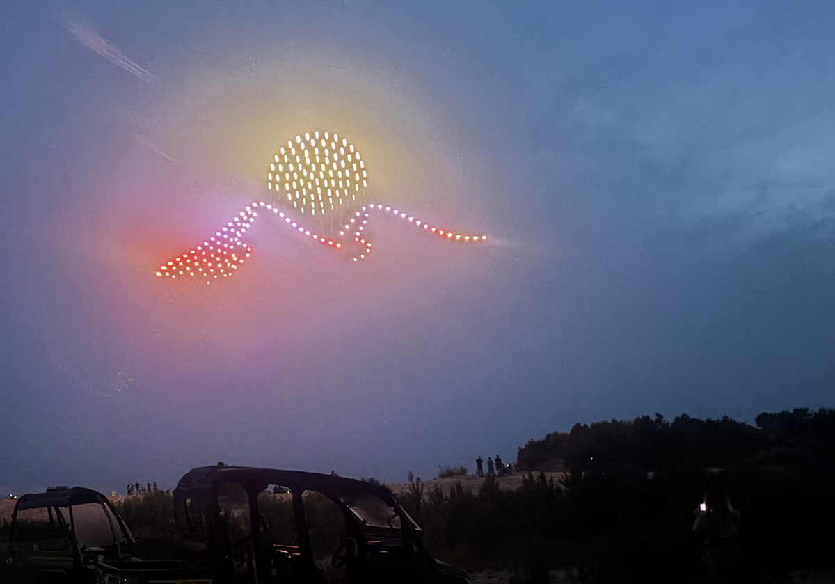 The drone light show during the celebration depicts the sun over the dunes. Photo: Catherine Kozak