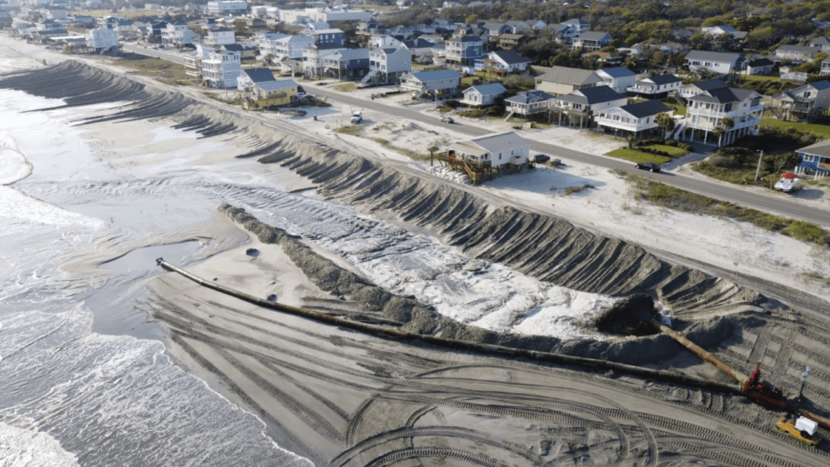 Oak island's beach nourishment work, such as this 2021 project, shown in process from above, includes creating a protective dune line. Photo: Town of Oak Island