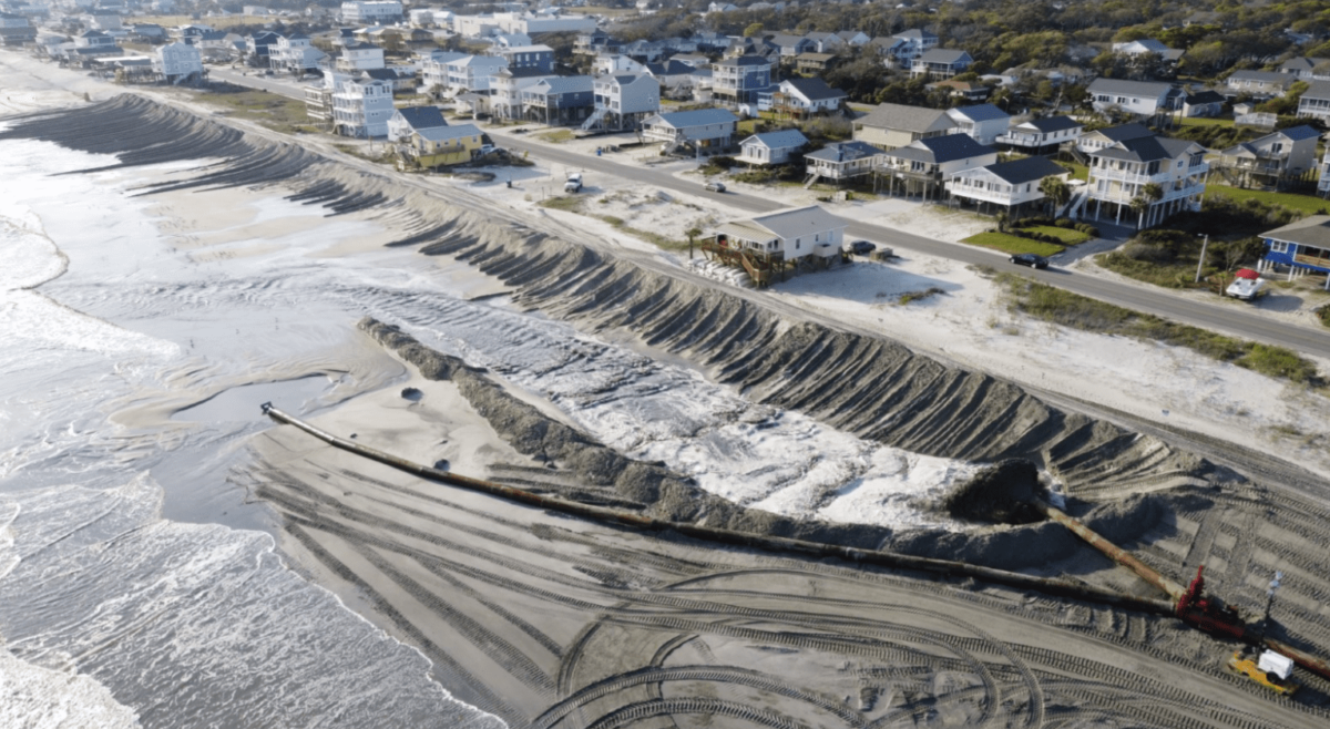 Oak island's beach nourishment work, such as this 2021 project, shown in process from above, includes creating a protective dune line. Photo: Town of Oak Island