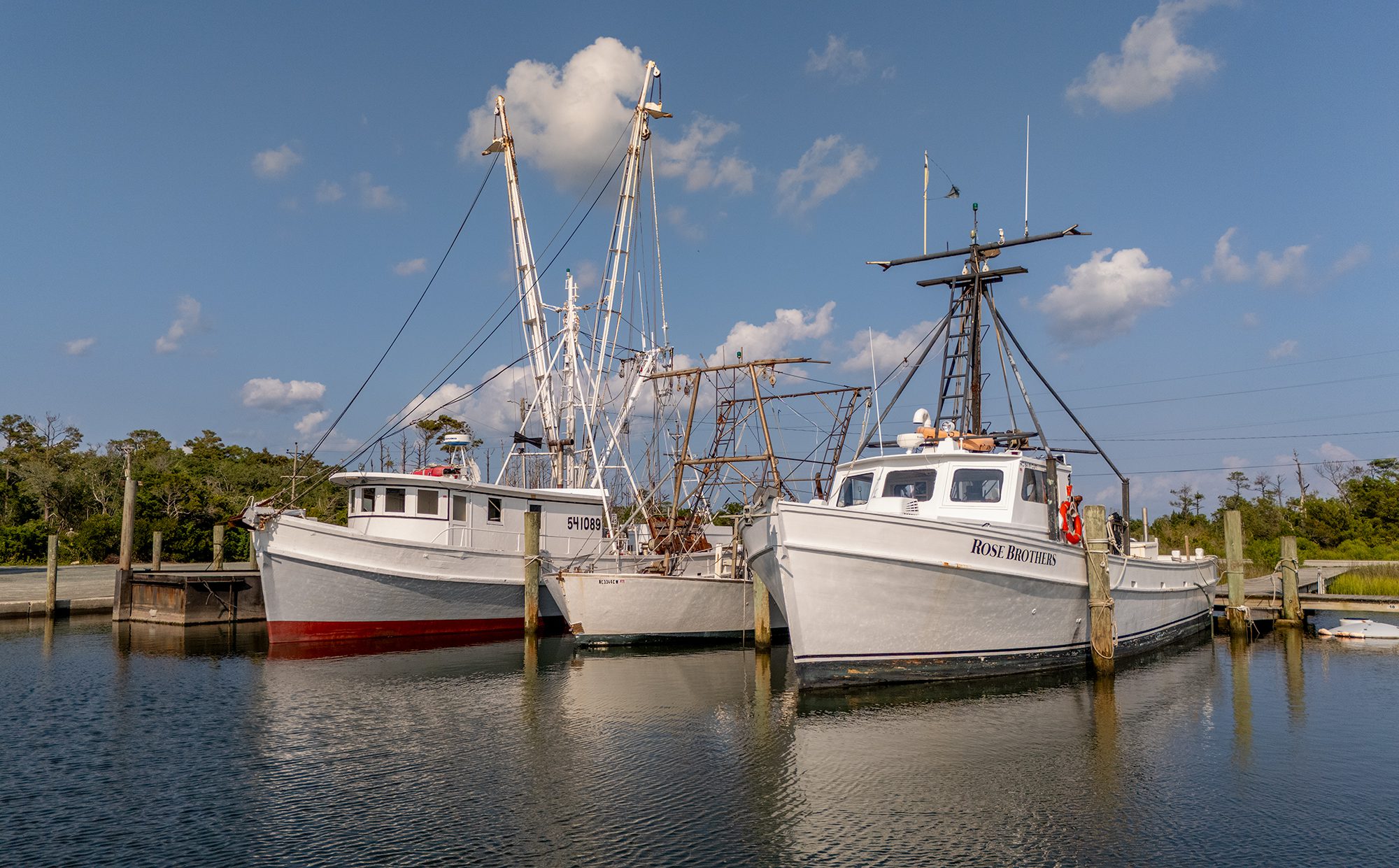 Commercial fishing vessels are shown docked recently at the Harkers Island Harbor of Refuge on Harkers Island in Carteret County. Photo: Dylan Ray