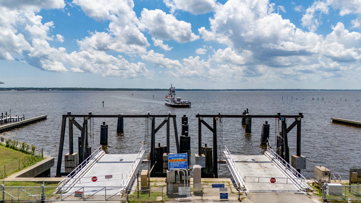 The North Carolina Department of Transportation Ferry Division vehicle ferry Avon prepares to dock at the Minnesott Beach Ferry Terminal in Pamlico County, making one of the service's numerous daily, 20-minute trips each way, back and forth between here and the Cherry Branch terminal across the Neuse River in Craven County. The Avon is one of 21 state ferries serving commuters and visitors on seven routes across the Neuse, Cape Fear and Pamlico rivers, and the Currituck and Pamlico sounds, and their schedules vary seasonally. Photo: Dylan Ray