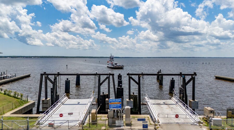 The North Carolina Department of Transportation Ferry Division vehicle ferry Avon prepares to dock at the Minnesott Beach Ferry Terminal in Pamlico County, making one of the service's numerous daily, 20-minute trips each way, back and forth between here and the Cherry Branch terminal across the Neuse River in Craven County. The Avon is one of 21 state ferries serving commuters and visitors on seven routes across the Neuse, Cape Fear and Pamlico rivers, and the Currituck and Pamlico sounds, and their schedules vary seasonally. Photo: Dylan Ray