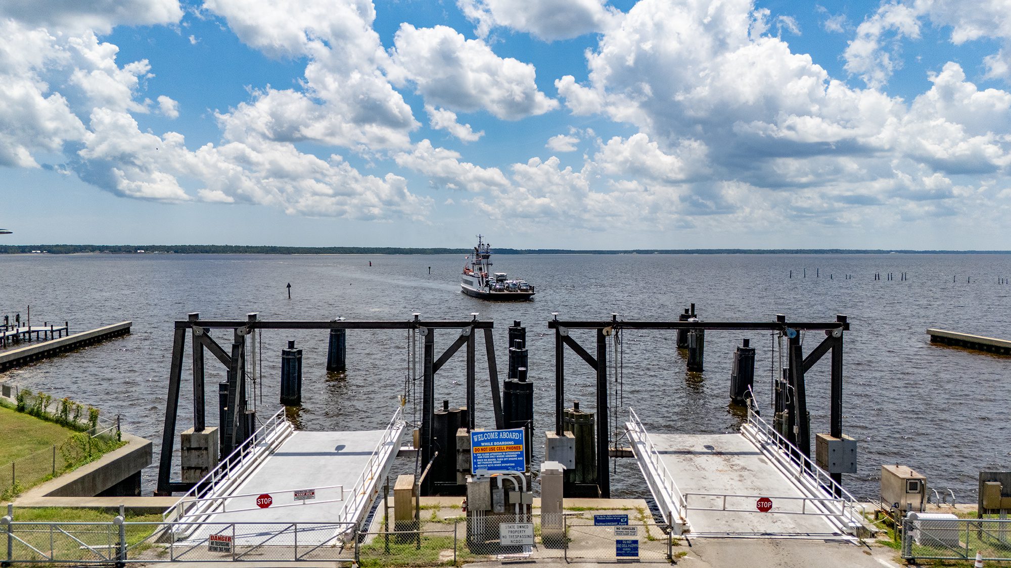 The North Carolina Department of Transportation Ferry Division vehicle ferry Avon prepares to dock at the Minnesott Beach Ferry Terminal in Pamlico County, making one of the service's numerous daily, 20-minute trips each way, back and forth between here and the Cherry Branch terminal across the Neuse River in Craven County. The Avon is one of 21 state ferries serving commuters and visitors on seven routes across the Neuse, Cape Fear and Pamlico rivers, and the Currituck and Pamlico sounds, and their schedules vary seasonally. Photo: Dylan Ray