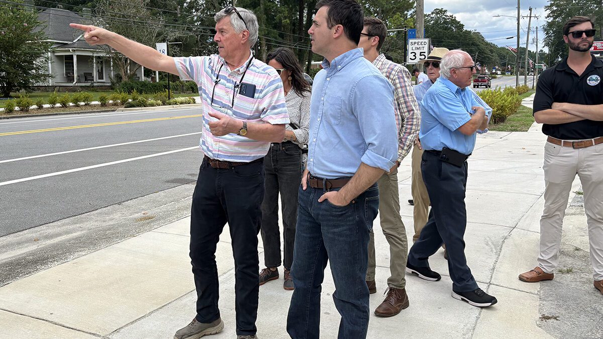 Pollocksville Mayor Jay Bender points out for state Attorney General Jeff Jackson Tuesday various structures in town set to be elevated using the federal funding. Photo: Trista Talton