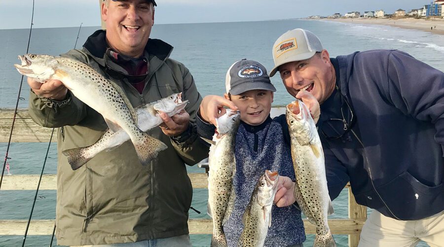 Gordon Churchill, left, shares a memorable fishing experience with Emerson Ellis and his dad Chris Ellis of Sneads Ferry.