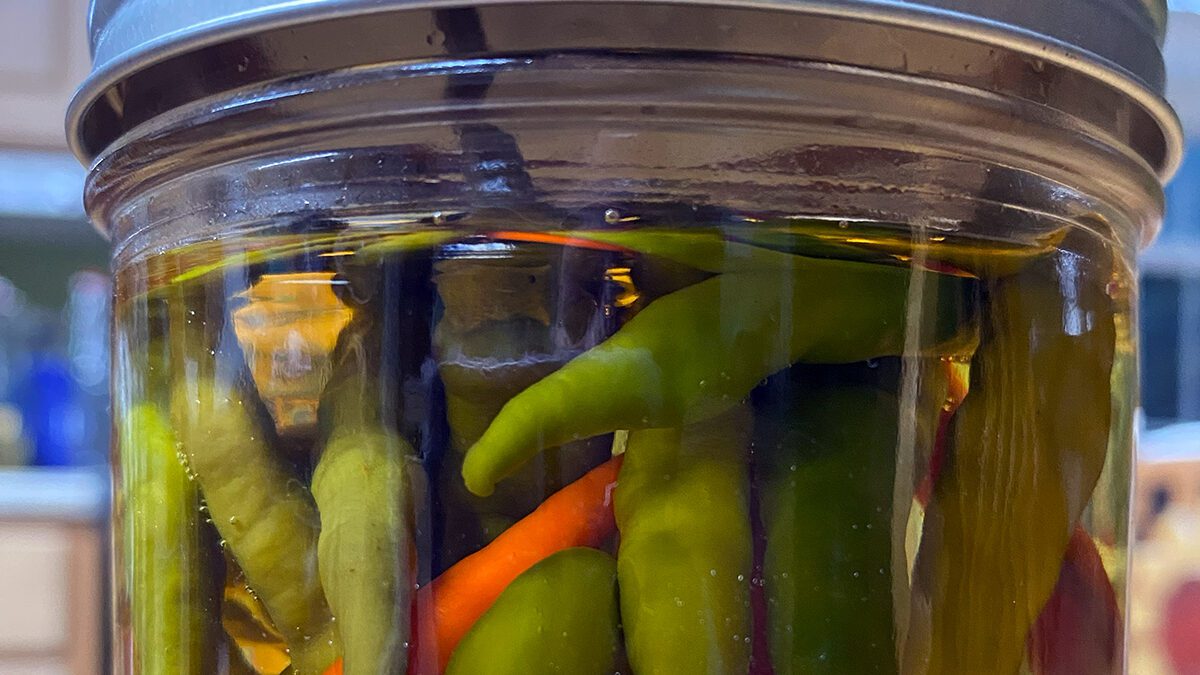 Homemade hot pepper vinegar is a coastal North Carolina staple paired with collards and fish. Photo: Heidi Skinner