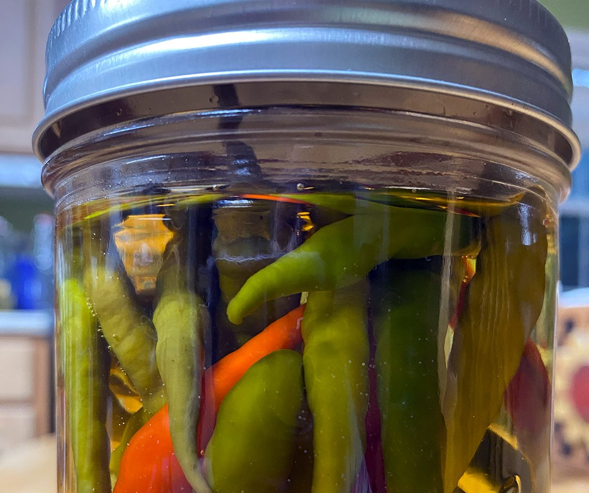 Homemade hot pepper vinegar is a coastal North Carolina staple paired with collards and fish. Photo: Heidi Skinner