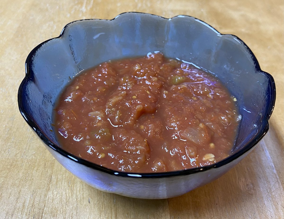 Salsa in a blue glass bowl brightens up a table the same way salsa livens up a meal. Photo: Heidi Skinner